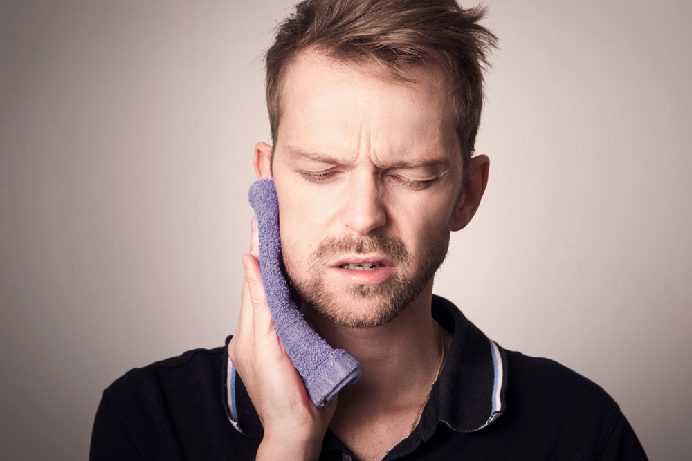 Emergency dentist treating knocked-out tooth trauma at Napa Dental Woodbridge